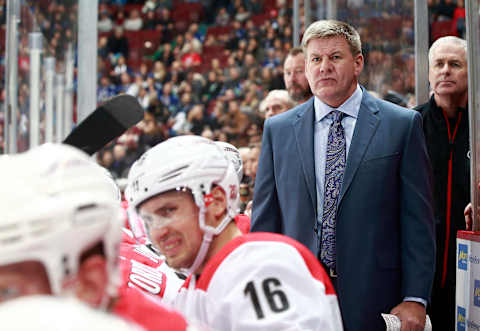 VANCOUVER, BC – DECEMBER 5: Head coach Bill Peters of the Carolina Hurricanes looks on from the bench during their NHL game against the Vancouver Canucks at Rogers Arena December 5, 2017 in Vancouver, British Columbia, Canada. (Photo by Jeff Vinnick/NHLI via Getty Images)’n