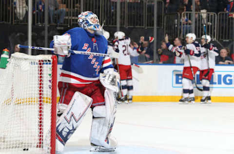 NEW YORK, NY – DECEMBER 27: Henrik Lundqvist #30 of the New York Rangers looks on as the Columbus Blue Jackets celebrate an overtime win at Madison Square Garden on December 27, 2018 in New York City. (Photo by Jared Silber/NHLI via Getty Images)