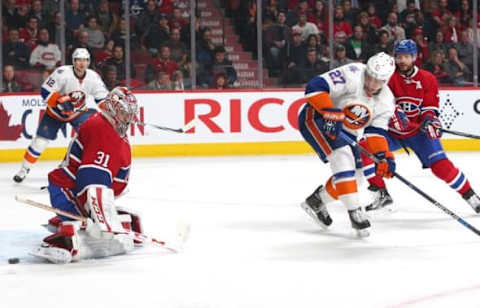 Nov 22, 2015; Montreal, Quebec, CAN; Montreal Canadiens goalie Carey Price (31) makes a save against New York Islanders center Anders Lee (27) as defenseman Andrei Markov (79) defends during the third period at Bell Centre. Mandatory Credit: Jean-Yves Ahern-USA TODAY Sports