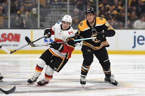 BOSTON, MA – JANUARY 3: David Pastrnak #88 of the Boston Bruins against Johnny Gaudreau #13 of the Calgary Flames at the TD Garden on January 3, 2019 in Boston, Massachusetts. (Photo by Steve Babineau/NHLI via Getty Images)