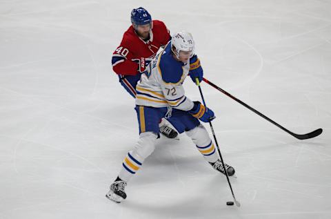 Feb 13, 2022; Montreal, Quebec, CAN; Buffalo Sabres right wing Tage Thompson (72) plays the puck against Montreal Canadiens right wing Joel Armia (40) during the second period at Bell Centre. Mandatory Credit: Jean-Yves Ahern-USA TODAY Sports