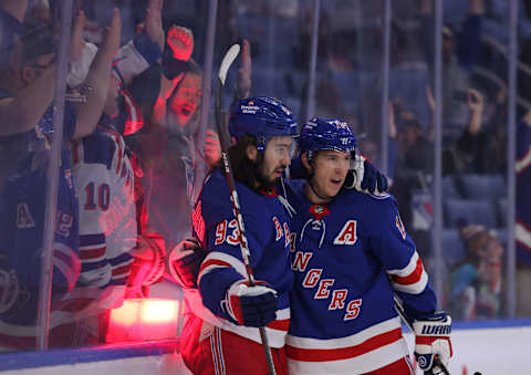 Dec 10, 2021; Buffalo, New York, USA; New York Rangers center Mika Zibanejad (93) celebrates his goal with center Ryan Strome (16) during the first period against the Buffalo Sabres at KeyBank Center. Mandatory Credit: Timothy T. Ludwig-USA TODAY Sports