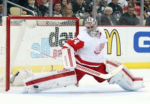 Feb 18, 2016; Pittsburgh, PA, USA; Detroit Red Wings goalie Petr Mrazek (34) makes a save against the Pittsburgh Penguins during the second period at the CONSOL Energy Center. Mandatory Credit: Charles LeClaire-USA TODAY Sports