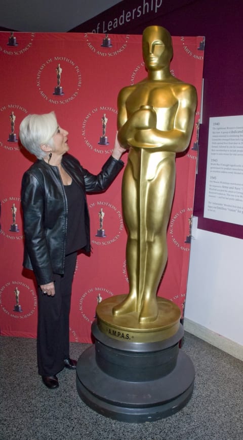 Olympia Dukakis with an Oscar statue.