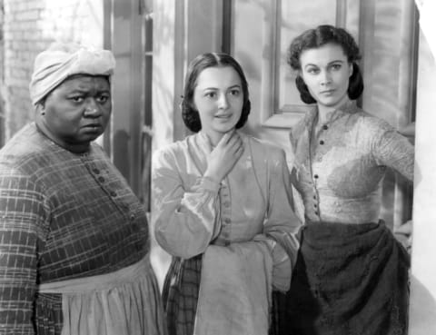 A publicity still from 1939's Gone with the Wind; at the 1940 Academy Awards, Hattie McDaniel (left) won the Oscar for Best Supporting Actress and Vivien Leigh (right) won Best Actress. Olivia de Havilland (center) was also nominated for Best Supporting Actress.