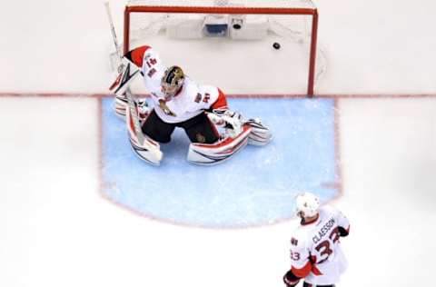 PITTSBURGH, PA – MAY 25: Craig Anderson #41 of the Ottawa Senators gives up the game-winning goal to Chris Kunitz #14 of the Pittsburgh Penguins in the second overtime in Game Seven to win the Eastern Conference Final during the 2017 NHL Stanley Cup Playoffs at PPG PAINTS Arena on May 25, 2017, in Pittsburgh, Pennsylvania. The Pittsburgh Penguins defeated the Ottawa Senators with a score of 3 to 2. (Photo by Jamie Sabau/Getty Images)