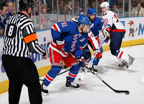 NEW YORK – APRIL 20: Markus Naslund #91 of the New York Rangers controls the puck against the Washington Capitals during Game Three of the Eastern Conference Quarterfinal Round of the 2009 Stanley Cup Playoffs on April 20, 2009 at Madison Square Garden in New York City. The Capitals defeat the Rangers 4-0. (Photo by Scott Levy/NHLI via Getty Images)