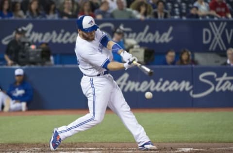 Apr 19, 2017; Toronto, Ontario, CAN; Toronto Blue Jays catcher Russell Martin (55) hits a double in the second inning during a game against the Boston Red Sox at Rogers Centre. Mandatory Credit: Nick Turchiaro-USA TODAY Sports. MLB.