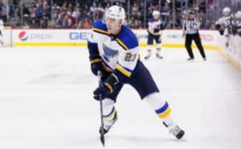 Apr 3, 2016; Denver, CO, USA; St. Louis Blues right wing Dmitrij Jaskin (23) controls the puck in the third period against the Colorado Avalanche at the Pepsi Center. The Blues defeated the Avalanche 5-1. Mandatory Credit: Isaiah J. Downing-USA TODAY Sports