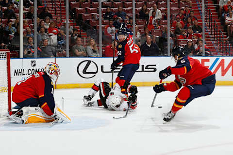 SUNRISE, FL – OCTOBER 13: Kyle Turris #7 of the Ottawa Senators is taken down next to the net by Brian Campbell #51 as Aaron Ekblad #5 clears the puck of the Florida Panthers at the BB&T Center on October 13, 2014 in Sunrise, Florida. (Photo by Joel Auerbach/Getty Images)