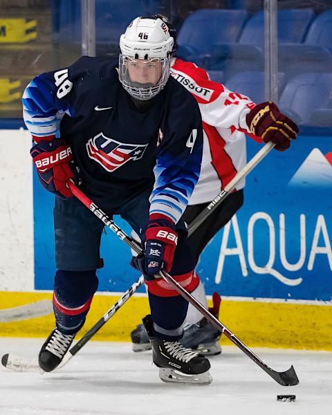 PLYMOUTH, MI – DECEMBER 12: Jake Sanderson #48 of the U.S. Nationals controls the puck against the Switzerland Nationals during day-2 of game two of the 2018 Under-17 Four Nations Tournament at USA Hockey Arena on December 12, 2018, in Plymouth, Michigan. The USA defeated Switzerland 3-1. (Photo by Dave Reginek/Getty Images)