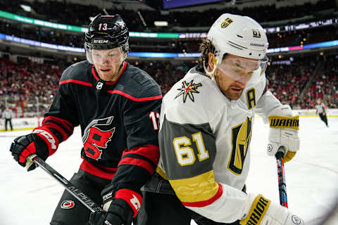 RALEIGH, NC – JANUARY 31: Carolina Hurricanes Right Wing Warren Foegele (13) and Vegas Golden Knights Right Wing Mark Stone (61) battle for a puck along the boards during a game between the Carolina Hurricanes and the Las Vegas Golden Knights on January 31, 2020 at the PNC Arena in Raleigh, NC. (Photo by Greg Thompson/Icon Sportswire via Getty Images)