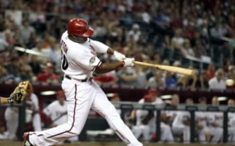 PHOENIX, AZ – SEPTEMBER 27: Justin Upton #10 of the Arizona Diamondbacks hits a single against the Los Angeles Dodgers during the eighth inning of the Major League Baseball game at Chase Field on September 27, 2011 in Phoenix, Arizona. (Photo by Christian Petersen/Getty Images)