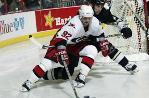 RALEIGH, NC – JANUARY 15: Jeff O’Neill #92 of the Carolina Hurricanes is chased by Michal Rozsival #28 of the Pittsburgh Penguins at the RBC Center on January 15, 2003 in Raleigh, North Carolina. The Penguins shutout the Hurricanes 2-0. (Photo by Craig Jones/Getty Images/NHLI)