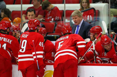 NHL Power Rankings: Carolina Hurricanes head coach Bill Peters talks to his players during t a time out during the third period at PNC Arena. The Philadelphia Flyers defeated the Carolina Hurricanes 4-3. Mandatory Credit: James Guillory-USA TODAY Sports