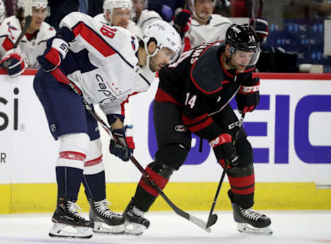 RALEIGH, NC – APRIL 15: Chandler Stephenson #18 of the Washington Capitals and Justin Williams #14 of the Carolina Hurricanes battle for position prior to the face-off in Game Three of the Eastern Conference First Round during the 2019 NHL Stanley Cup Playoffs on April 15, 2019 at PNC Arena in Raleigh, North Carolina. (Photo by Gregg Forwerck/NHLI via Getty Images)