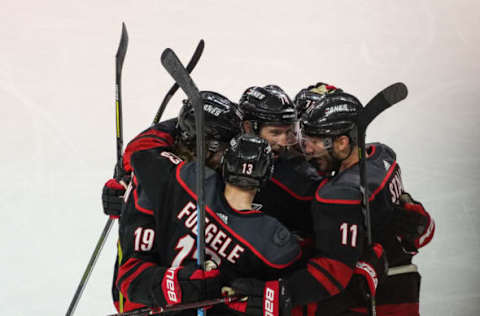 RALEIGH, NC – APRIL 15: Carolina Hurricanes defenseman Dougie Hamilton (19) is surrounded by teammates after scoring in the third period during a game between the Carolina Hurricanes and the Washington Capitals at the PNC Arena in Raleigh, NC on April 15, 2019. (Photo by Greg Thompson/Icon Sportswire via Getty Images)