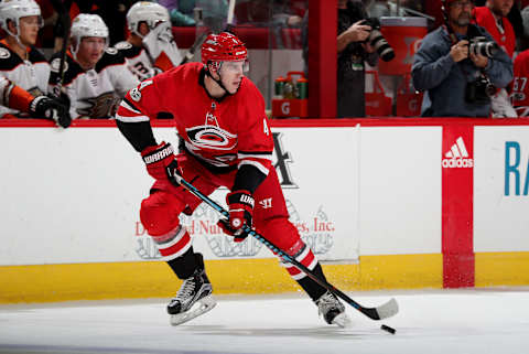 RALEIGH, NC – OCTOBER 29: Haydn Fleury #4 of the Carolina Hurricanes controls a puck on the ice during an NHL game against the Anaheim Ducks on October 29, 2017 at PNC Arena in Raleigh, North Carolina. (Photo by Gregg Forwerck/NHLI via Getty Images)