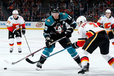 ANAHEIM, CA – APRIL 3: Corey Perry #10 of the Anaheim Ducks battles for the puck against Oscar Fantenberg #3 of the Calgary Flames during the game on April 3, 2019 at Honda Center in Anaheim, California. (Photo by Debora Robinson/NHLI via Getty Images)