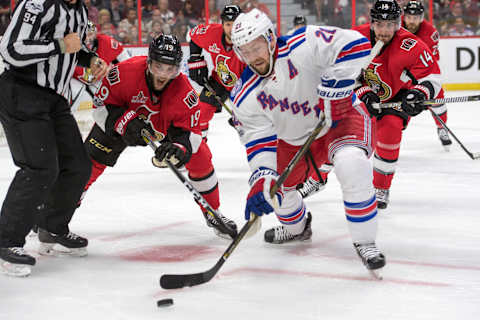 Apr 27, 2017; Ottawa, Ontario, CAN; New York Rangers center Derek Stepan (21) skates with the puck following a faceoff against Ottawa Senators center Derick Brassard (19) in the first period of game one in the second round of the 2017 Stanley Cup Playoffs at Canadian Tire Centre. Mandatory Credit: Marc DesRosiers-USA TODAY Sports