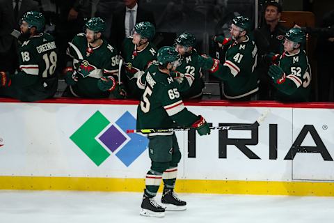 Oct 6, 2021; Saint Paul, Minnesota, USA; Minnesota Wild right wing Brandon Duhaime (65) celebrates with teammates after scoring a goal against the St. Louis Blues in the third period at Xcel Energy Center. Mandatory Credit: David Berding-USA TODAY Sports