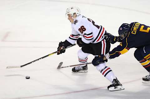 ST CATHARINES, ON – OCTOBER 11: Christopher Cameron #5 of the Barrie Colts struggles to contain Philip Tomasino #26 of the Niagara IceDogs during the first period of an OHL game at Meridian Centre on October 11, 2018, in St Catharines, Canada. (Photo by Vaughn Ridley/Getty Images)