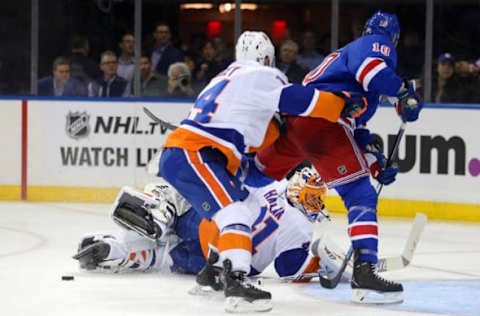 NHL Power Rankings: New York Islanders goalie Jaroslav Halak (41) comes out of the goal to make a save against New York Rangers center J.T. Miller (10) in front of New York Islanders defenseman Thomas Hickey (14) during the second period at Madison Square Garden. Mandatory Credit: Brad Penner-USA TODAY Sports