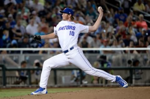 Jun 19, 2016; Omaha, NE, USA; Florida Gators pitcher A.J. Puk (10) pitches against the Coastal Carolina Chanticleers in the eighth inning in the 2016 College World Series at TD Ameritrade Park. Coastal Carolina defeated Florida 2-1. Mandatory Credit: Steven Branscombe-USA TODAY Sports