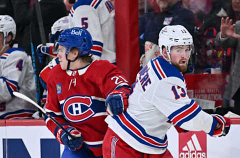 MONTREAL, CANADA – MARCH 09: Kaiden Guhle #21 of the Montreal Canadiens and Alexis Lafrenière #13 of the New York Rangers skate against each other during the second period at Centre Bell on March 9, 2023, in Montreal, Quebec, Canada. The New York Rangers defeated the Montreal Canadiens 4-3 in a shootout. Photo by Minas Panagiotakis/Getty Images)