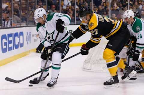 Nov 5, 2013; Boston, MA, USA; Dallas Stars center Rich Peverley (17) and Boston Bruins defenseman Dougie Hamilton (27) battle for a puck during the first period at TD Banknorth Garden. Mandatory Credit: Greg M. Cooper-USA TODAY Sports