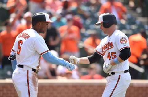 BALTIMORE, MD – JUNE 17: Mark Trumbo #45 of the Baltimore Orioles celebrates hitting a solo home run in seventh inning with Jonathan Schoop #6 during a baseball game against the Miami Marlins at Oriole Park at Camden Yards on June 17, 2018 in Baltimore, Maryland. (Photo by Mitchell Layton/Getty Images)