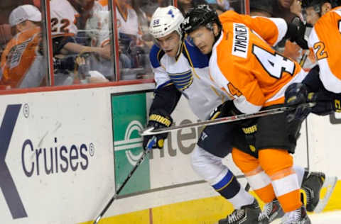 Mar 22, 2014; Philadelphia, PA, USA; St. Louis Blues left wing Magnus Paajarvi (56) battles for the puck with Philadelphia Flyers defenseman Kimmo Timonen (44) during the third period at Wells Fargo Center. The Flyers won 4-1. Mandatory Credit: Eric Hartline-USA TODAY Sports