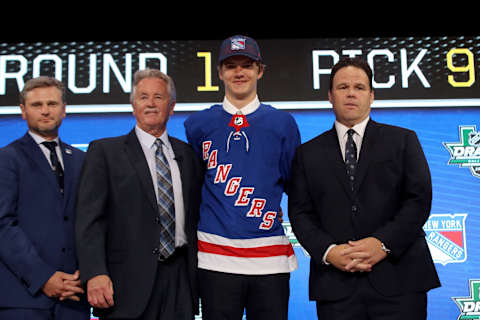 Vitali Kravtsov posesafter being selected ninth overall by the New York Rangers (Photo by Bruce Bennett/Getty Images)