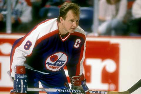 LANDOVER, MD – JANUARY 23: Randy Carlyle #8 of the Winnipeg Jets looks on before a hockey game against the Washington Capitals on January 23, 1990 at Capital Centre in Landover, Maryland. The Jets won 4-3. (Photo by Mitchell Layton/Getty Images)