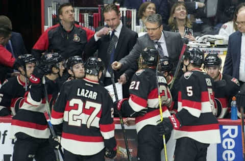 Apr 7, 2016; Ottawa, Ontario, CAN; Ottawa Senators head coach Dave Cameron speaks with his players leading into the last minute of play in the third period against the Florida Panthers at the Canadian Tire Centre. The Senators defeated the Panthers 3-1. Mandatory Credit: Marc DesRosiers-USA TODAY Sports