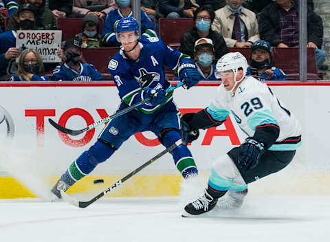 Oct 5, 2021; Vancouver, British Columbia, CAN; Seattle Kraken defenseman Vince Dunn (29) checks Vancouver Canucks defenseman Tyler Myers (57) in the third period at Rogers Arena. Seattle won 4-0. Mandatory Credit: Bob Frid-USA TODAY Sports