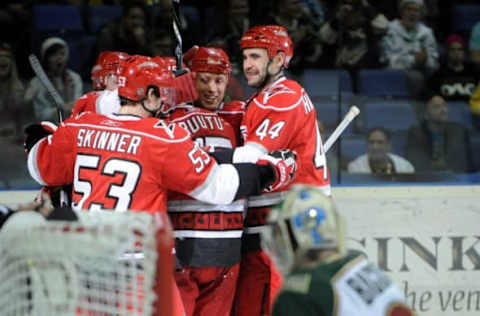 Hurricanes’ Jeff Skinner (L), Jay Harrison (R), and Jussi Jokinen (L) celebrate Tuomo Ruutu’s (C) game-tying 1-1 goal during the ice hockey NHL regular-season game Carolina Hurricanes vs Minnesota Wild in Helsinki on October 8, 2010. AFP PHOTO LEHTIKUVA / Heikki Saukkomaa *** FINLAND OUT *** (Photo by – / LEHTIKUVA / AFP) (Photo credit should read -/AFP via Getty Images)