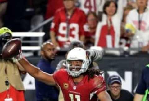 Sep 11, 2016; Glendale, AZ, USA; Arizona Cardinals wide receiver Larry Fitzgerald (11) celebrates after catching a touchdown pass against the New England Patriots in the fourth quarter at University of Phoenix Stadium. The catch was the 100th touchdown of his career. The Patriots defeated the Cardinals 23-21. Mandatory Credit: Mark J. Rebilas-USA TODAY Sports