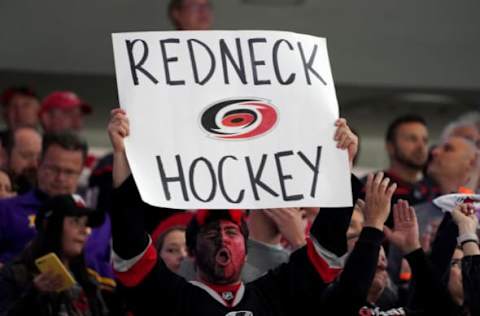 RALEIGH, NC – MAY 14: Fans of the Carolina Hurricanes celebrate in Game Three of the Eastern Conference Third Round against the Boston Bruins during the 2019 NHL Stanley Cup Playoffs on May 14, 2019 at PNC Arena in Raleigh, North Carolina. (Photo by Gregg Forwerck/NHLI via Getty Images)