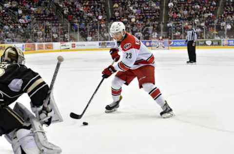 HERSHEY, PA – FEBRUARY 09: Charlotte Checkers center Janne Kuokkanen (23) stickhandles in on Hershey Bears goalie Vitek Vanecek (30) as the final shooter in the shootout of the Charlotte Checkers vs. Hershey Bears AHL game February 9, 2019 at the Giant Center in Hershey, PA. (Photo by Randy Litzinger/Icon Sportswire via Getty Images)