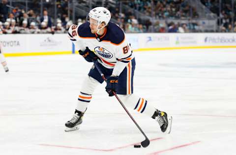 SEATTLE, WASHINGTON - DECEMBER 03: Philip Broberg #86 of the Edmonton Oilers shoots against the Seattle Kraken during the third period at Climate Pledge Arena on December 03, 2021 in Seattle, Washington. (Photo by Steph Chambers/Getty Images)