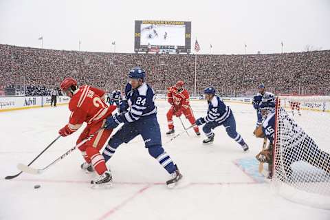 ANN ARBOR, MI – JANUARY 1: (EDITORIAL USE ONLY) Tomas Tatar #21 of the Detroit Red Wings controls the puck as Peter Holland #24 of the Toronto Maple Leafs . (Photo by Jamie Sabau/Getty Images)