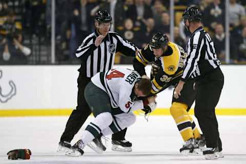 Nov 19, 2015; Boston, MA, USA; Boston Bruins left wing Matt Beleskey (39) fights with Minnesota Wild right wing Brett Bulmer (54) during the first period at TD Garden. Mandatory Credit: Greg M. Cooper-USA TODAY Sports