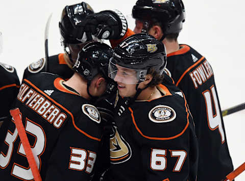 ANAHEIM, CA – MARCH 22: Anaheim Ducks left wing Rickard Rakell (67) with his teammates after Rakell scored a goal in the third period of a game against the San Jose Sharks played on March 22, 2019, at the Honda Center in Anaheim, CA. (Photo by John Cordes/Icon Sportswire via Getty Images)