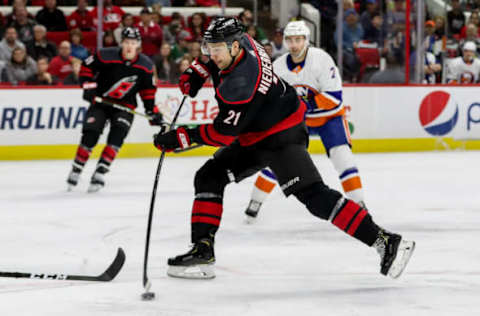 RALEIGH, NC – JANUARY 19: Carolina Hurricanes Right Wing Nino Niederreiter (21) steps into a shot during an NHL game between the Carolina Hurricanes and New York Islanders on January 19, 2020 at the PNC Arena in Raleigh, NC. (Photo by John McCreary/Icon Sportswire via Getty Images)