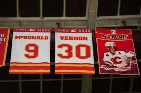 CALGARY, CANADA – FEBRUARY 24: The retired numbers of former Calgary Flames players. (Photo by Derek Leung/Getty Images)