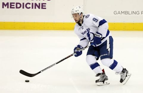 May 26, 2016; Pittsburgh, PA, USA; Tampa Bay Lightning center Tyler Johnson (9) skates with the puck against the Pittsburgh Penguins during the second period in game seven of the Eastern Conference Final of the 2016 Stanley Cup Playoffs at the CONSOL Energy Center. The Penguins won the game 2-1 and the Eastern Conference Championship four games to three. Mandatory Credit: Charles LeClaire-USA TODAY Sports