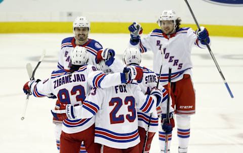 May 13, 2022; Pittsburgh, Pennsylvania, USA; the New York Rangers celebrate a goal by center Mika Zibanejad (93) against the Pittsburgh Penguins during the second period in game six of the first round of the 2022 Stanley Cup Playoffs at PPG Paints Arena. Mandatory Credit: Charles LeClaire-USA TODAY Sports