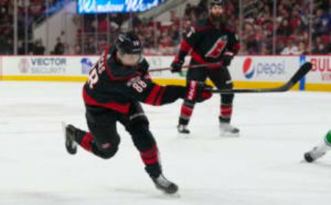 Jan 15, 2023; Raleigh, North Carolina, USA; Carolina Hurricanes center Martin Necas (88) takes a shot against the Vancouver Canucks during the first period at PNC Arena. Mandatory Credit: James Guillory-USA TODAY Sports