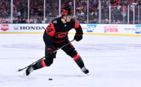 RALEIGH, NORTH CAROLINA – FEBRUARY 18: Seth Jarvis #24 of the Carolina Hurricanes controls the puck against the Washington Capitals during the first period in the 2023 Navy Federal Credit Union NHL Stadium Series at Carter-Finley Stadium on February 18, 2023 in Raleigh, North Carolina. (Photo by Grant Halverson/Getty Images)